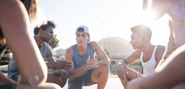 Basketball, team and meeting for sports game plan, strategy or collaboration on the court in the outdoors. Group of athletic people in sport discussion, teamwork or planning for competitive match. - Photo, image
