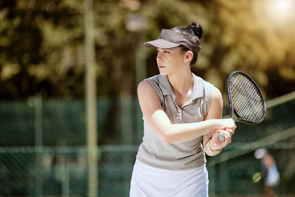Tennis, racket and woman playing a game on an outdoor court for fitness, competition or training. Sports, workout and healthy athlete practicing for match on outside field in Canada with mockup - Φωτογραφία, εικόνα