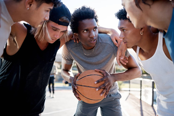 Basketball, team and huddle on basketball court in trust circle for motivation, planning and game strategy. Fitness, friends and basketball players share sport goal, mission and support while talking. - Foto, afbeelding
