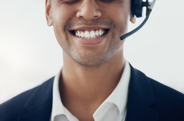 Call center, face and man consulting for crm, customer support and telemarketing sales closeup. Customer service, contact us and consultant, happy and smile about sale, e commerce and management. - Photo, Image