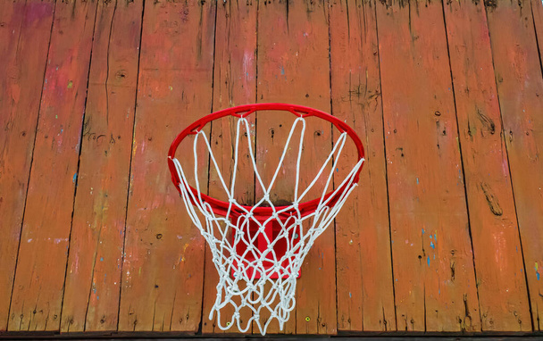 Basketball hoop with a net on a wooden backboard. Basketball game. Throw the ball. Team play. Street sports. Rest and leisure. Sports ground. Healthy lifestyle. Background image. - Photo, Image