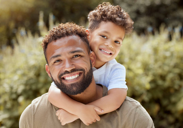 Portrait, happy father and boy smile in garden fun, vacation and break in summer happiness together. Black man and child smile, love and hug outdoor bonding free time on a sunny day in the park. - Foto, Bild