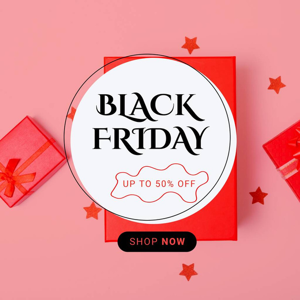 Composition of black friday up to 50 percent off shop now text over presents on pink background. Black friday, shopping and retail concept digitally generated image. - Foto, Bild