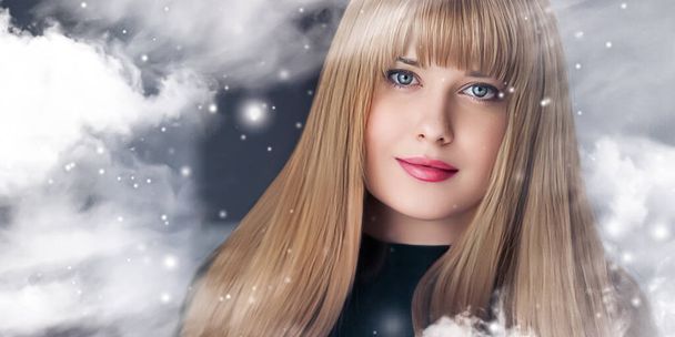 Winter beauty, Christmas time and happy holidays, beautiful woman with long hairstyle and natural make-up behind frozen window, snowing snow design as xmas, New Year and holiday lifestyle portrait - Фото, зображення