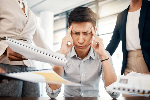Businessman, stress and overwhelmed with headache, burnout or workload from colleagues at the office. Corporate man multi tasking suffering from mental health issues, overworked or tired at workplace. - Foto, Imagem