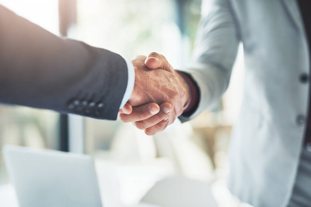 Well do great things together. two unrecognizable businessmen shaking hands after making a deal in the office - Fotografie, Obrázek