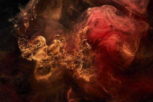 Red black sparkling abstract background, luxury golden smoke, acrylic paint underwater explosion, cosmic swirling ink - Φωτογραφία, εικόνα