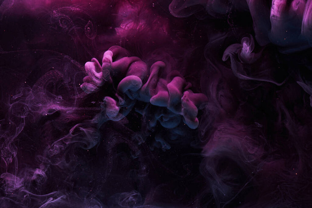 Purple dark abstract background, luxury colored smoke, acrylic paint underwater explosion, cosmic swirling ink - Photo, image