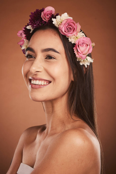 Beauty, skincare and portrait of woman with flower crown, smile on face and fresh clean glowing skin. Happy girl model, from Mexico with pink rose band in hair and and fashion with studio background - Photo, image
