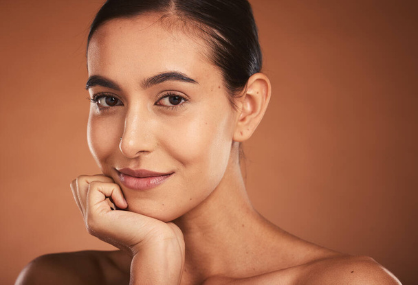 Makeup, skincare and portrait of a woman with a smile for cosmetics against a brown mockup studio background. Face of a happy, luxury and cosmetic model with wellness, beauty and care for skin. - Фото, зображення