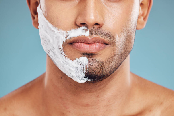 Face, shaving and beauty cream man closeup of beard facial, wellness and grooming product advertising. Cosmetic, skincare and shave foam hygiene routine of male model with teal studio background - Foto, imagen