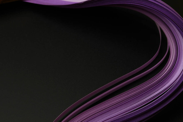 Violet color strip wave paper on black. Abstract texture background. - Φωτογραφία, εικόνα
