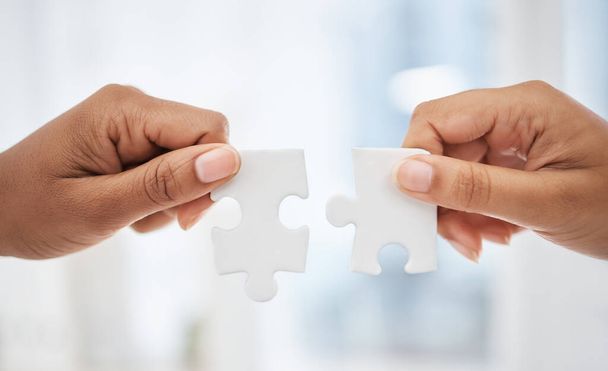 Closeup hands puzzle, problem solving teamwork in information technology and cyber ux coding business. Jigsaw hand team, together for collaboration strategy in web design and app innovation in office. - Photo, Image