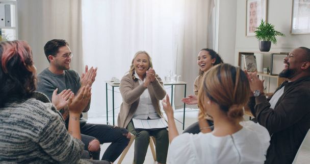 Group, clapping hands and counselling meeting for mental health, laugh and team happy, support and together in circle. Therapy session, depression and applause for breakthrough, motivation or talking. - Φωτογραφία, εικόνα