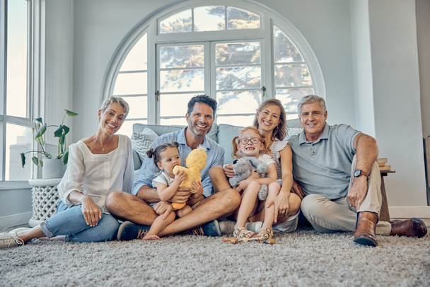 Family, love and generations together in family home, happy in portrait for quality time and bonding. Care, smile and grandparents with parents and children in living room, big family and happiness - Foto, Imagem