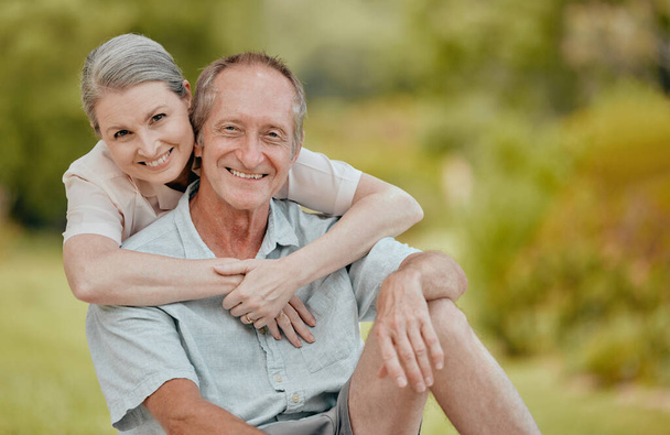 Love, smile and portrait of old couple in nature on vacation, holiday or summer trip. Relax, hug and happy senior, retired man and woman outdoors enjoying quality time together and bonding at park - Photo, Image