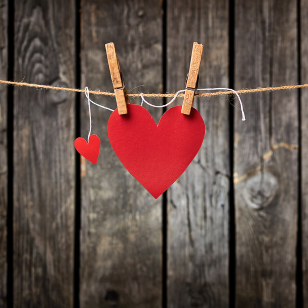 Two paper hearts hang on clothesline - Foto, imagen