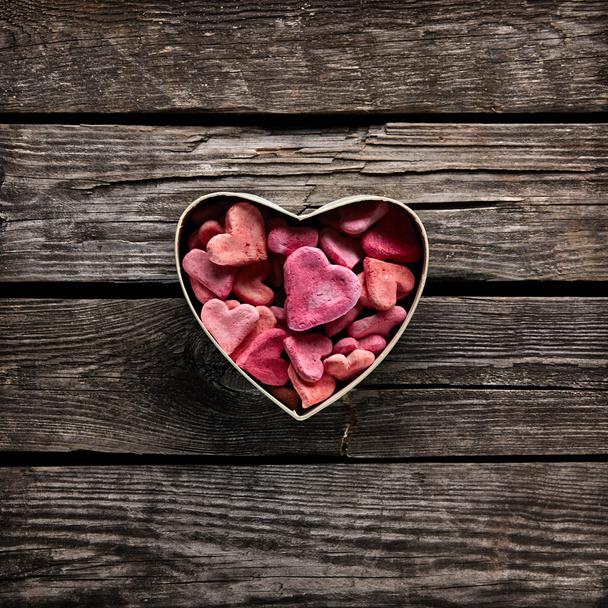Open heart shaped gift box with heap of small hearts - Valokuva, kuva