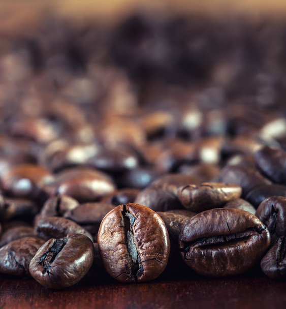 Roasted coffee beans on the table. - Foto, Imagem