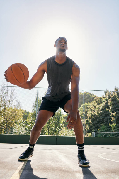 Basketball player, dribble basketball court at training and workout ready for contest, sport or game with ball. Sports, basketball or black man preparation, outdoor or exercise for summer competition. - Fotografie, Obrázek