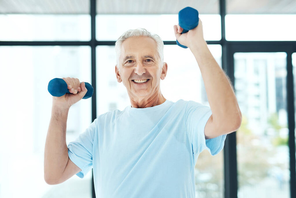 Get older not weaker. a senior man working out with dumbbells - Photo, Image