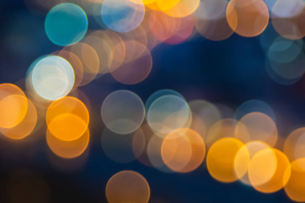 Abstract city lights blur blinking background. Soft focus horizontal long banner. Bokeh sparkles colorful defocused on dark texture for night party city. Abstract blurred pattern template. - Foto, Imagem