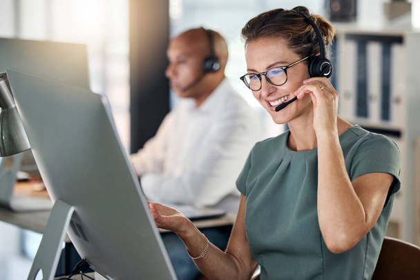 Customer service, call center and crm with a woman consultant working in a telemarketing office. Support, computer and sales with a female consulting using a headset for help, assist or communication. - Foto, Imagen