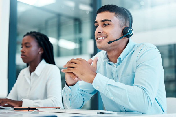 Call center, customer service and support with a man consultant using a headset in his office at work. Communication, crm and contact us with a male consulting while working in telemarketing. - Valokuva, kuva