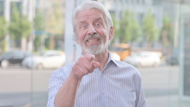 Senior Old Man Pointing at the Camera and Inviting Outdoor - Photo, image