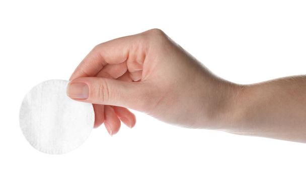 Woman holding soft clean cotton pad on white background, closeup - Foto, Bild