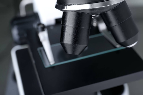 Modern medical microscope with glass slide, closeup - Foto, Imagem