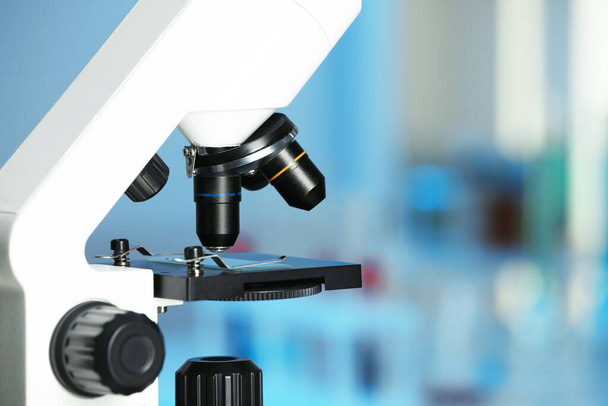 Modern medical microscope on blurred background, closeup. Space for text - Foto, Bild