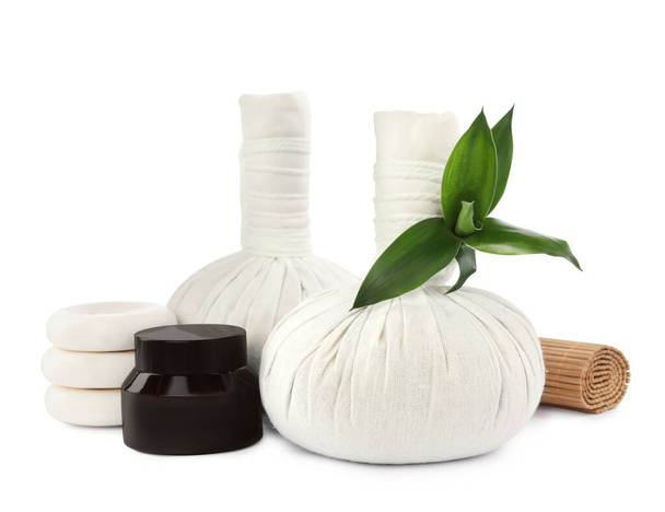 Herbal massage bags and other spa products on white background - Photo, image
