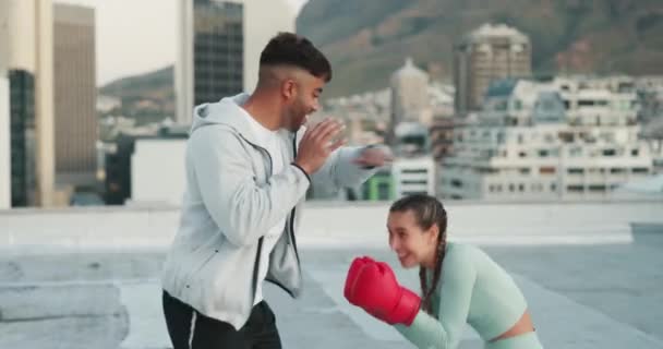 Fitness, couple and boxing in the city for sport training, exercise or workout together outdoors. Personal trainer man and woman boxer in sports exercising, cardio or fighting practice on a roof top. - Footage, Video