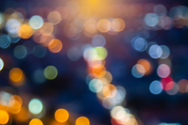 Abstract city lights blur blinking background. Soft focus horizontal long banner. Bokeh sparkles colorful defocused on dark texture for night party city. Abstract blurred pattern template. - Zdjęcie, obraz