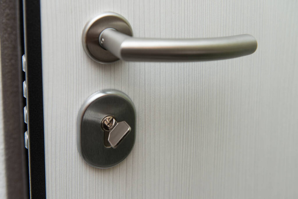 Modern Metal Key and Key Hole and Door - Very Sturdy Steel Door - Foto, Imagen