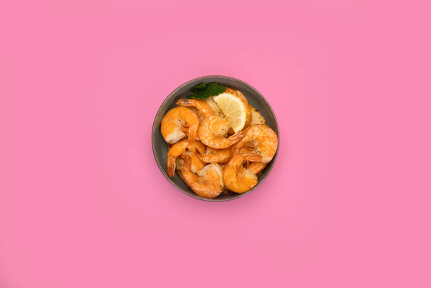 Shrimps on color background. Traditional food. Creative photo concept. Top view, copy space - Фото, изображение