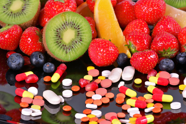 Berries, fruits, vitamins and nutritional supplements  - Photo, Image