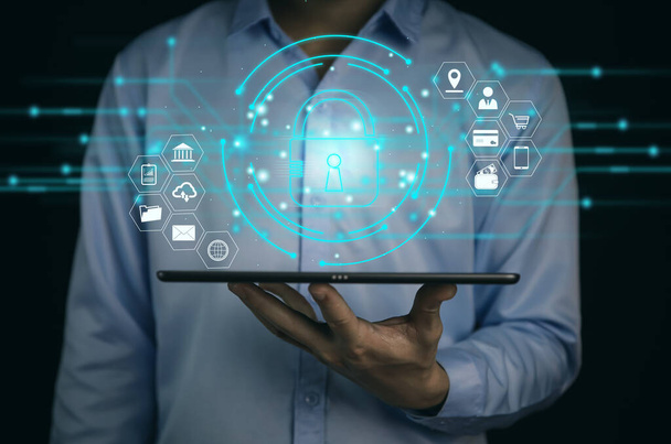 A businessman selects a lock icon on a virtual display. Internet network security concept, website connection. to prevent hackers from cyber attacks Digital technology, user privacy encryption - Photo, Image