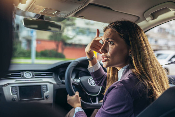 Angry young woman pissed off by drivers gesturing with hands - Photo, Image