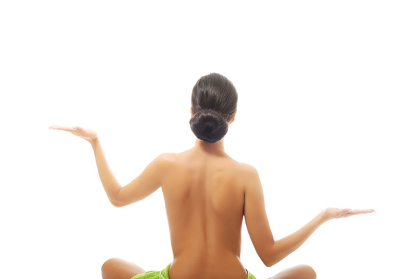 Back view woman sitting excercising yoga - Fotografie, Obrázek