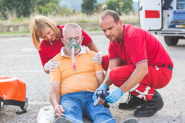 Rescue Team Providing First Aid - Foto, afbeelding