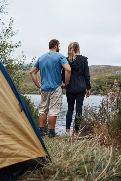Relax, camping and nature with couple at lake for adventure, vacation and health trip. Journey, peace and lifestyle with man and woman thinking in countryside for travel, summer or freedom together. - Фото, зображення