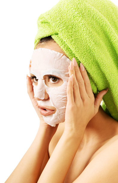 Portrait of a woman with revitality face mask - Foto, afbeelding