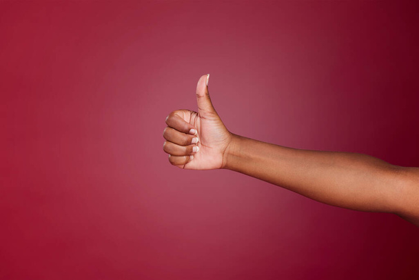 Thumbs up, yes and agreement hand sign of a black woman showing support, motivation and success. Thank you, goal and happy winner hands gesture to show good news, done goal and achievement victory. - Photo, Image