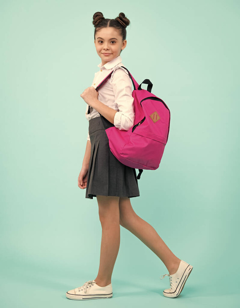 School teen girl in with backpack. Teenager student on blue isolated background. Learning, education and knowledge. 1 september, knowledge day - Foto, Imagen