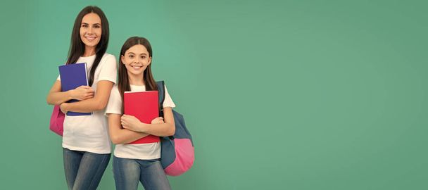 Mother and daughter child banner, copy space, isolated background. childhood education. happy pupil and student with school bag. mom and teen girl study - Valokuva, kuva