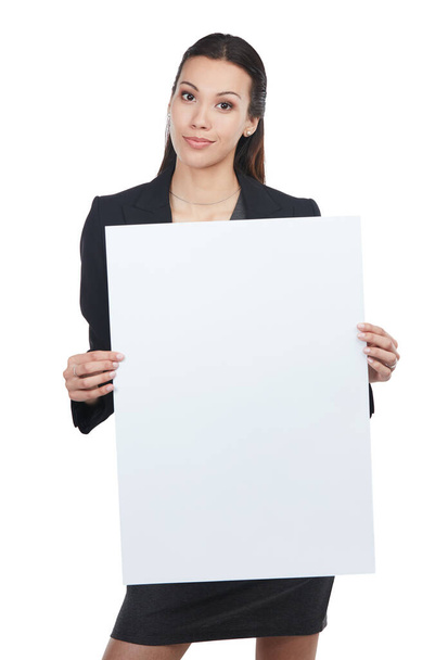 Trust me. This is the one. Portrait of an attractive young businesswoman holding up a blank signboard - Photo, Image