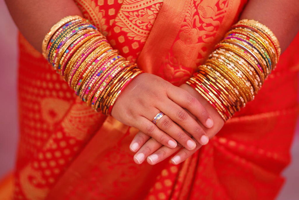 Colorful view of set of bangles and hands together in bridal - Foto, Imagen