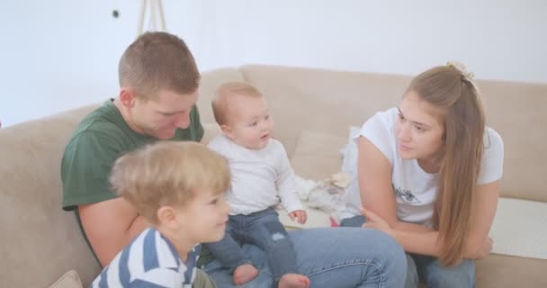 Caring parents are enjoining themselves in company of their children - Footage, Video